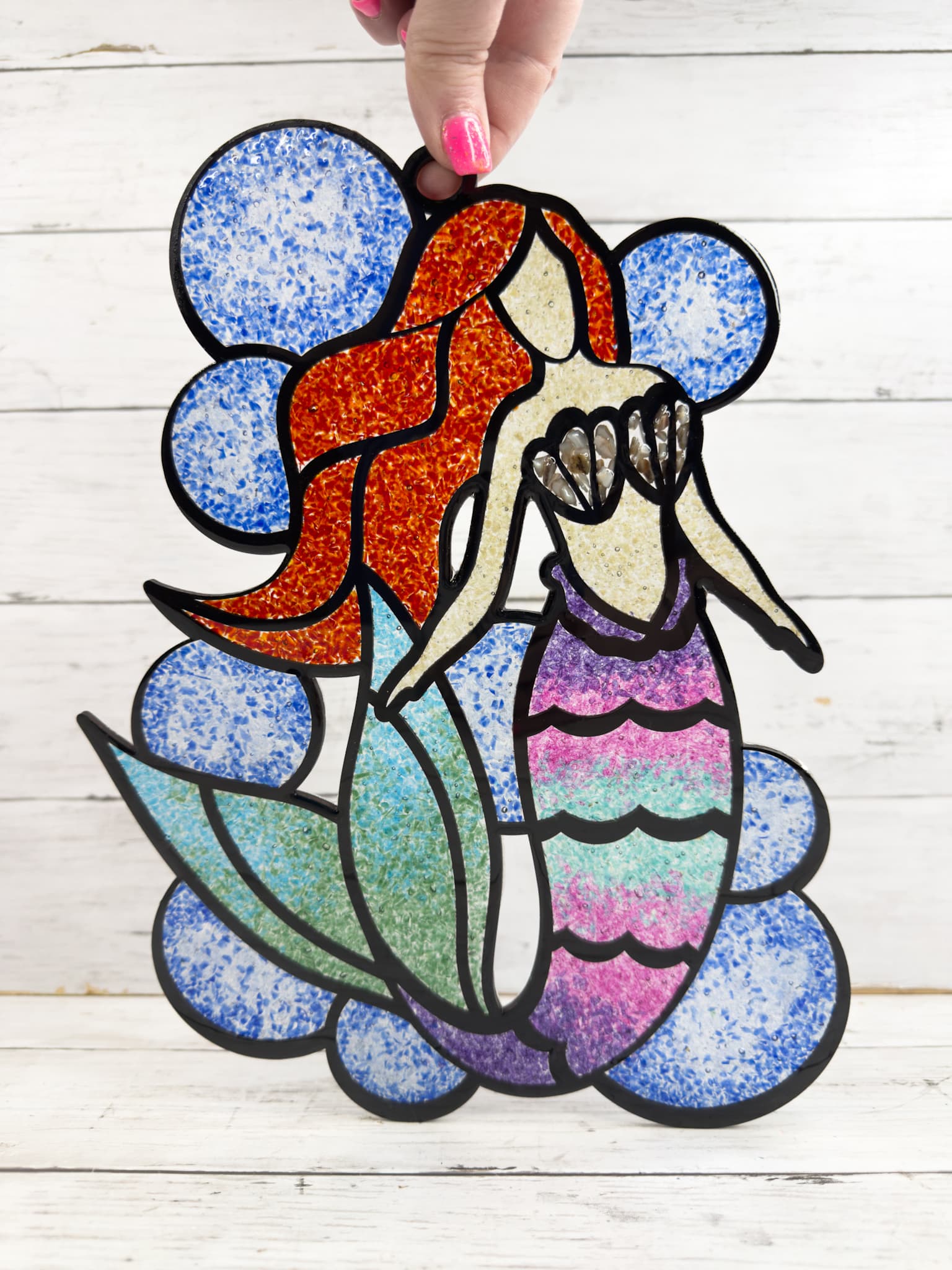 finished Faux Stained Glass Mermaid Suncatcher after it's cured with basic background