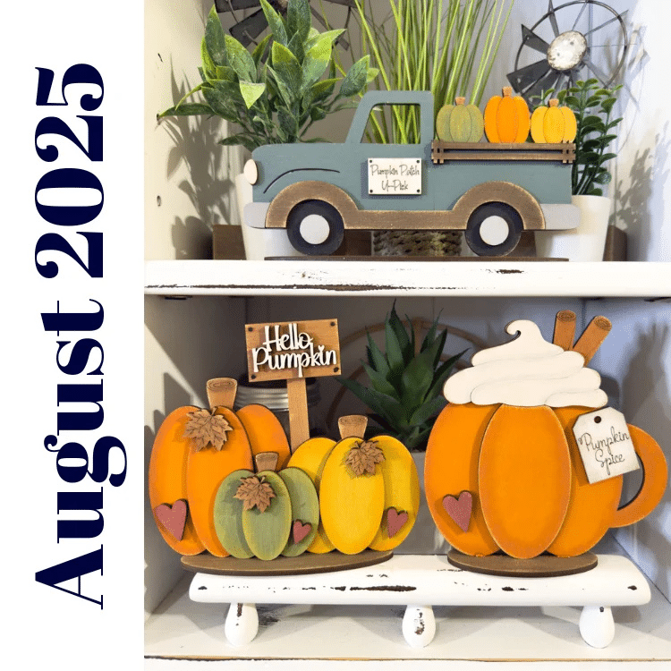 fall tiered tray set including blue truck carying pumpkins, pumpkin trio with sign, and pumpkin spice latte displayed on a shelf