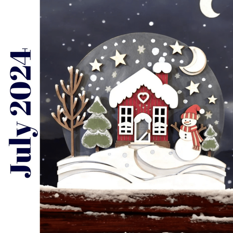 winter snowglobe scene with red house, little snowman, winter sky, and landscape painted and assembled