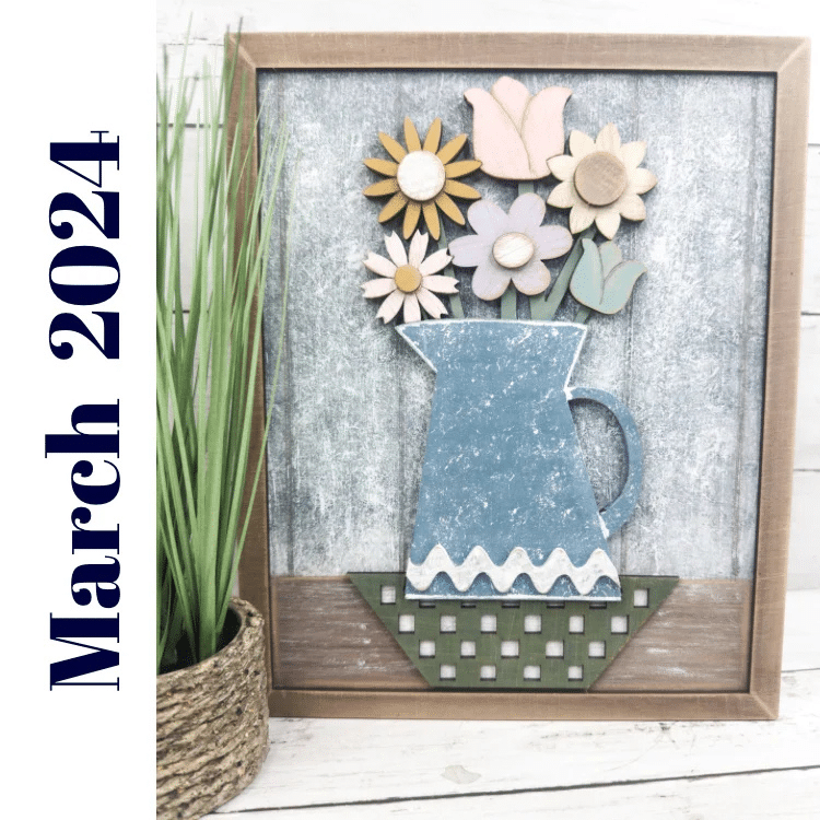 farmhouse framed sign with a blue pitcher used as a vase for a flower bouquet