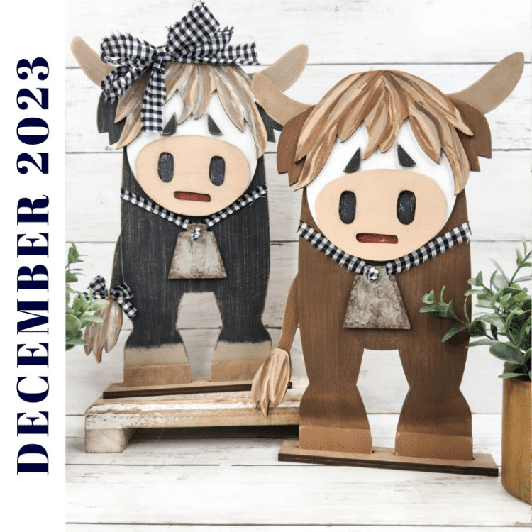 two rustic highland cows painted and assembled for display