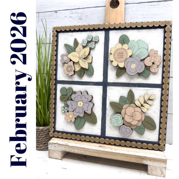 framed collage of wooden flowers painted with pastel color palletes
