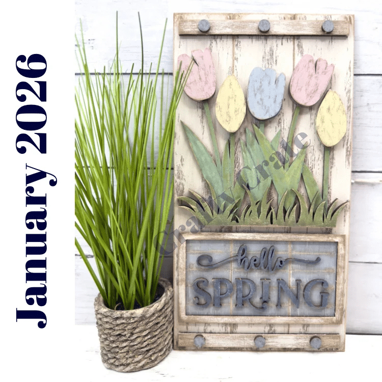 hello spring wooden sign with pastel tulips painted and displayed with farmhouse greenery