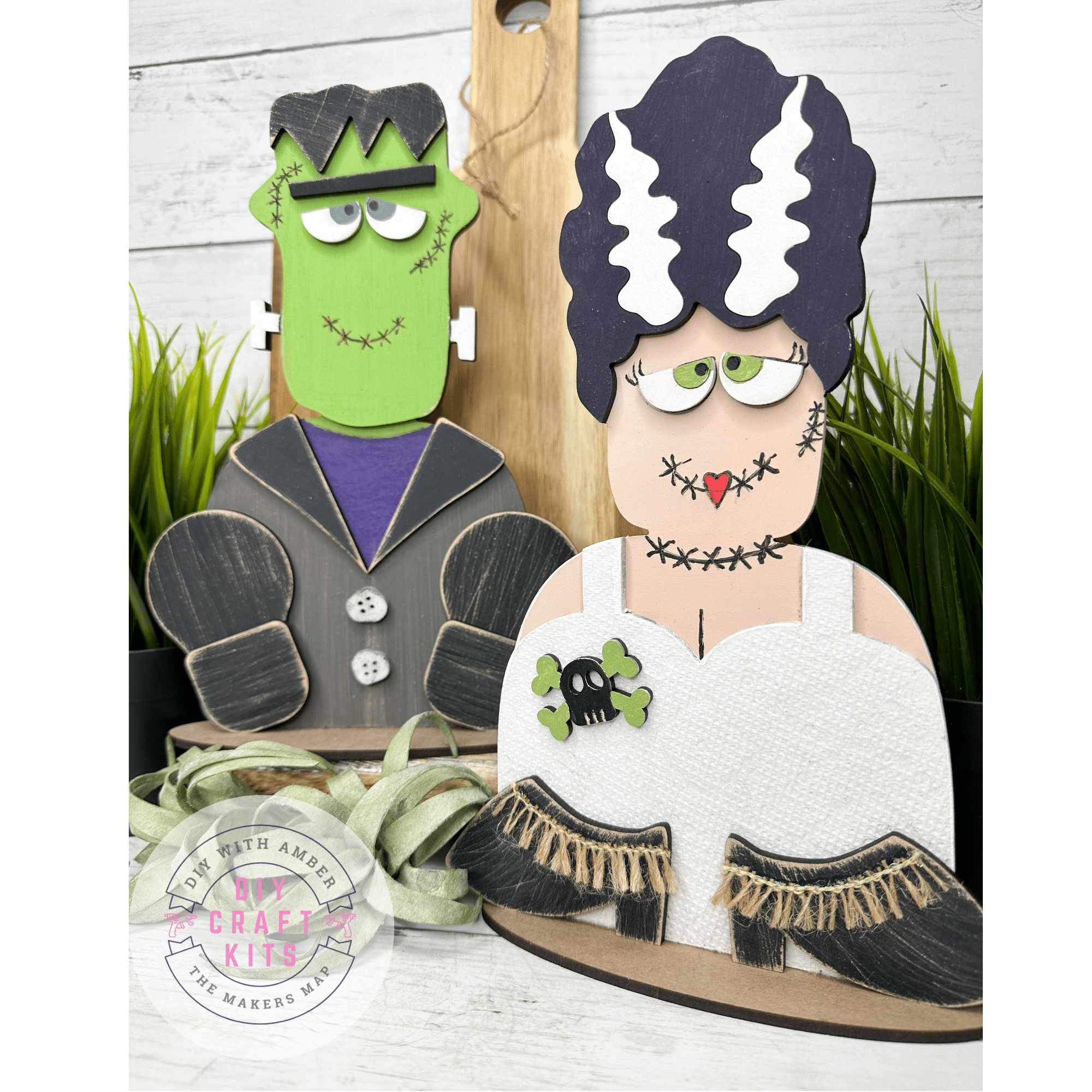 frankenstein and bride of frankenstein halloween diy craft kits painted and assembled with DIY with Amber The Maker's Map DIY Craft Kits Logo in the bottom left corner