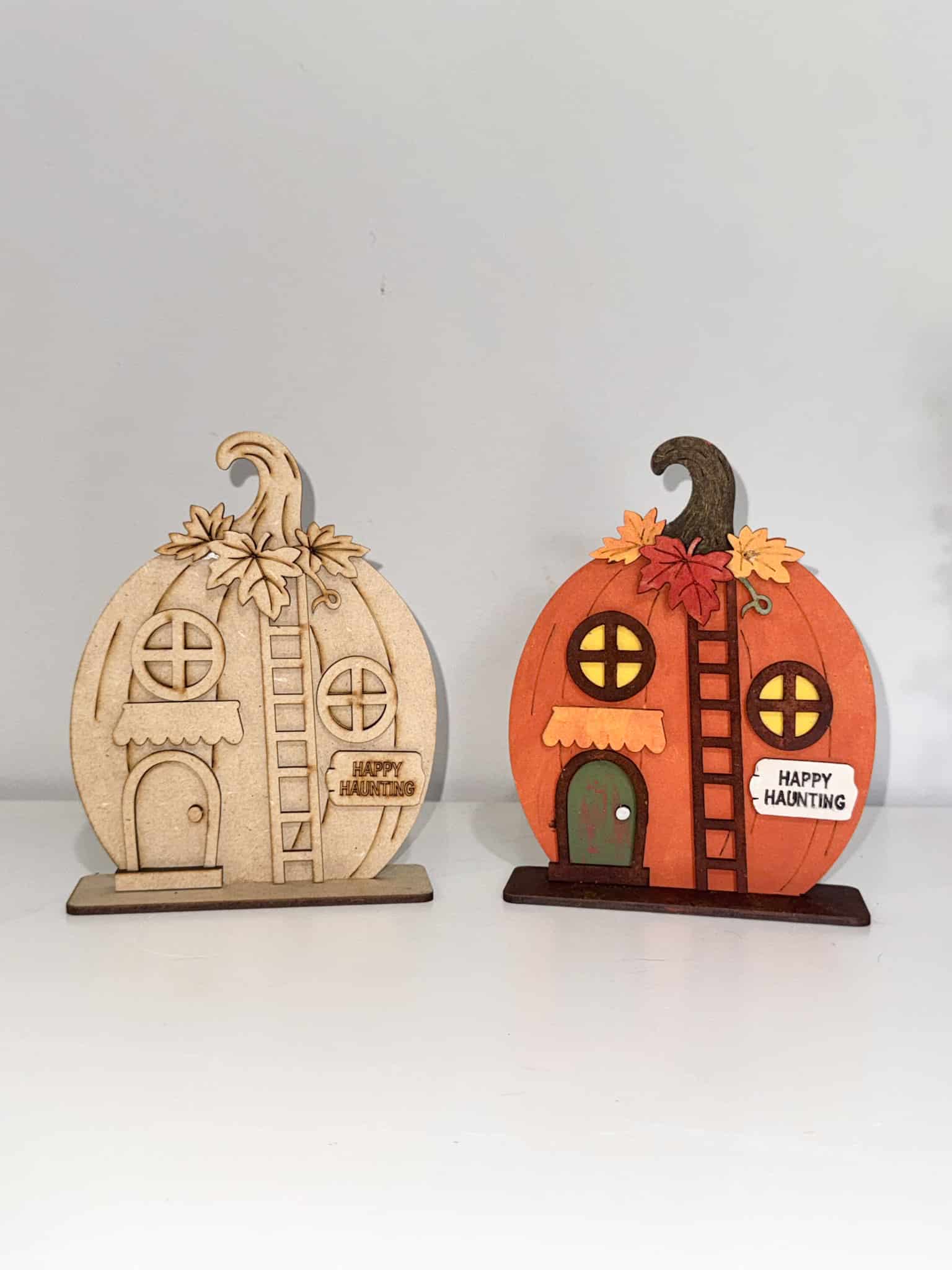 Happy Haunting Pumpkin House DIY craft kit comparison showing unfinished wood pumpkin house beside the completed painted Halloween decor.